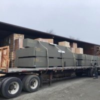Crating loaded onto truck bed